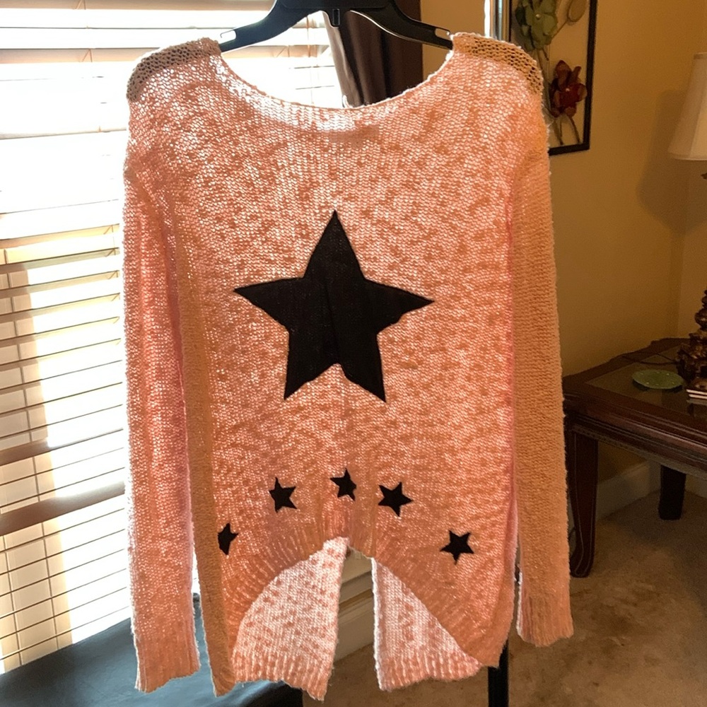 Never worn star sweater. Cute pink color, good material.
